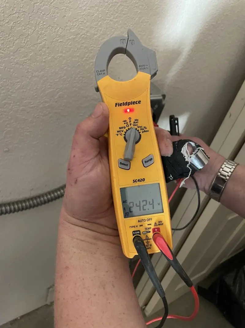 Voltage testing with clamp meter during Outlet Installation in Vandalia